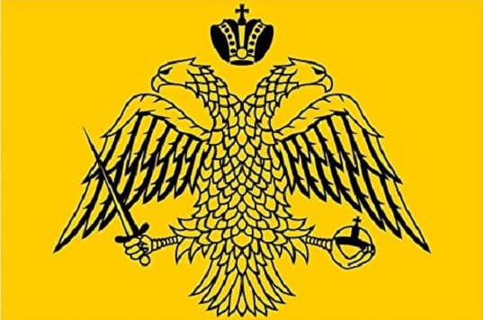 The Byzantine Empire flag with a black double-headed eagle on a gold background.