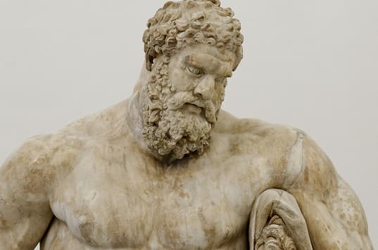 The Farnese Hercules statue - a muscular and powerful depiction of the mythological hero Hercules.